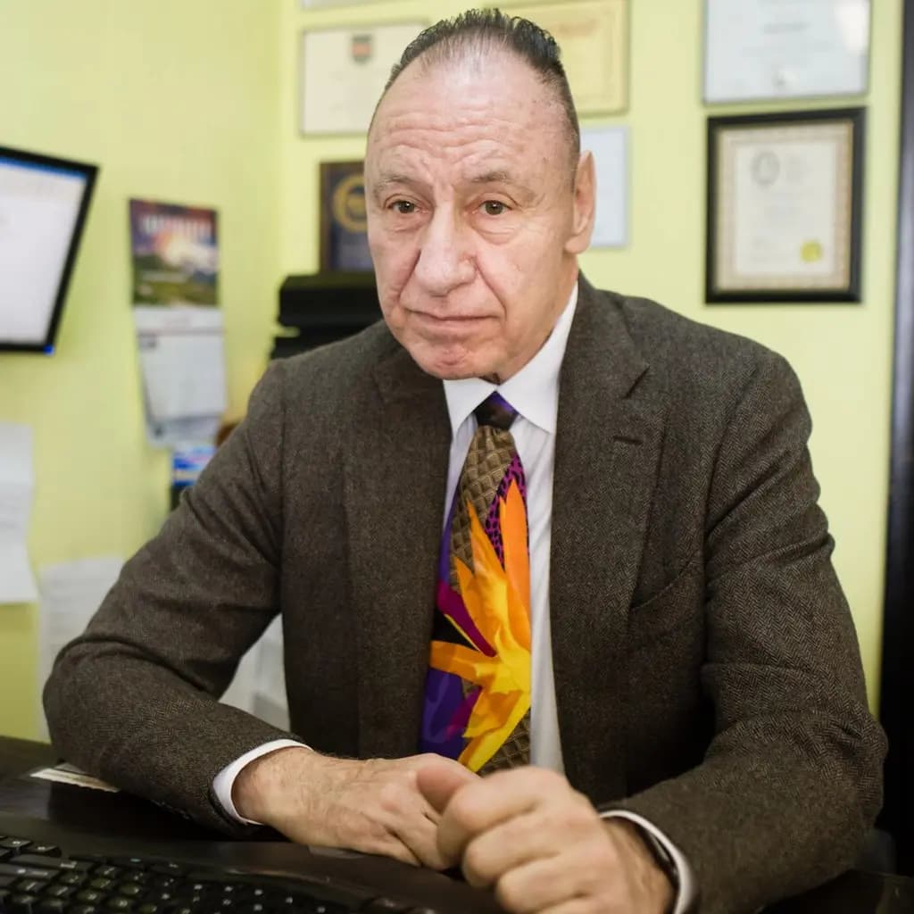 Eugene Butler at his desk in his Flint office